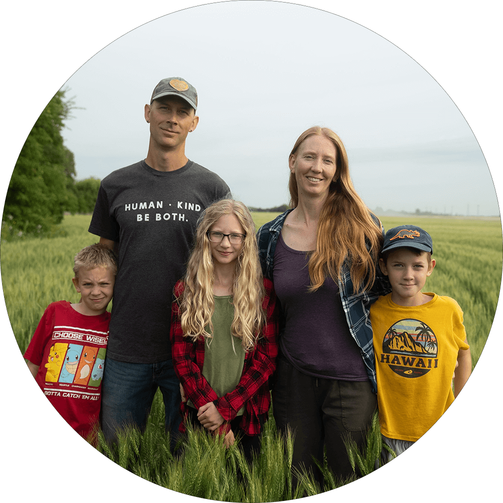 Jason Rempel and family standing in a wheat field Jason Rempel and family standing in a wheat field