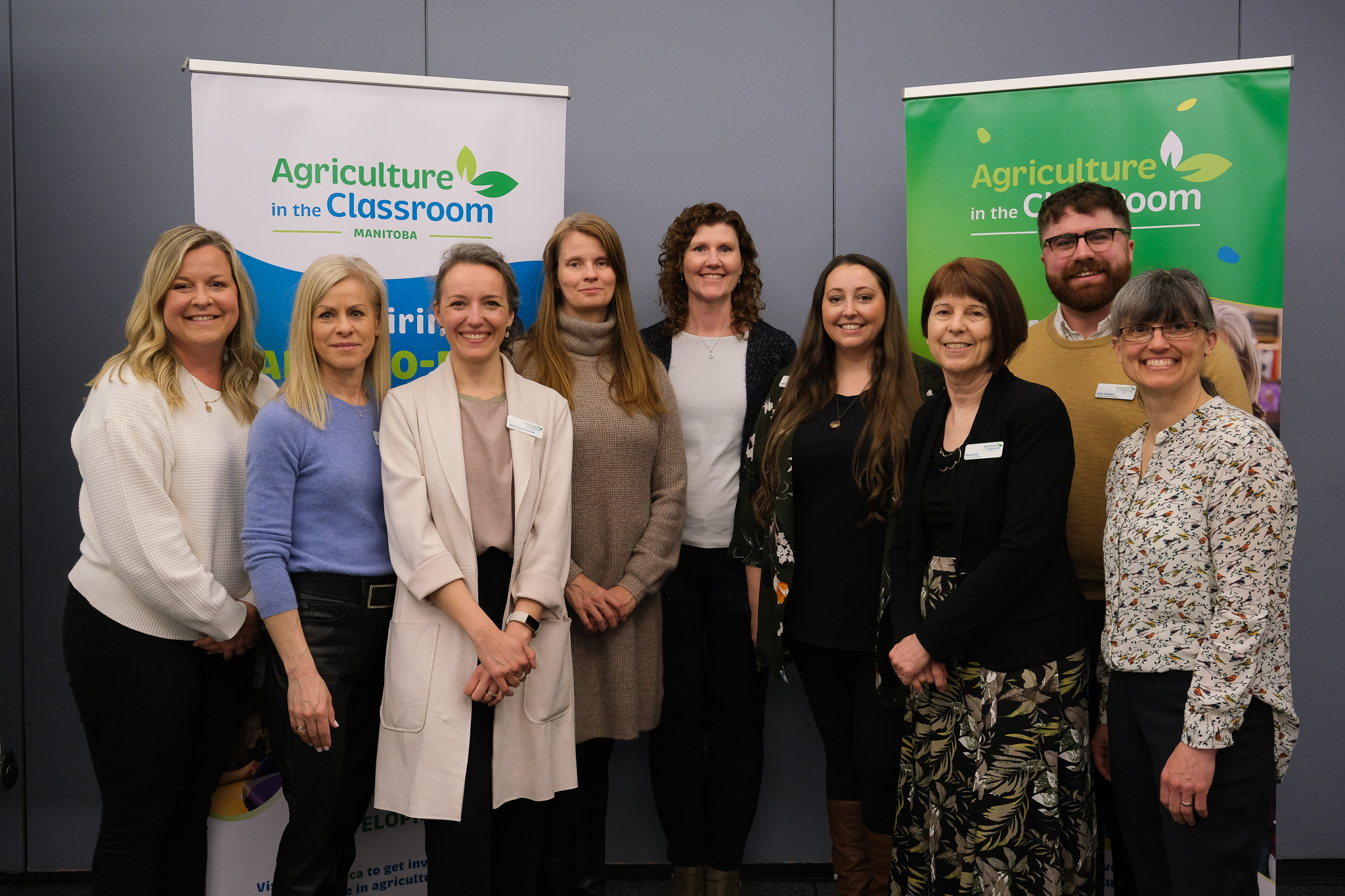 Group of AITC-M employees posing in a group