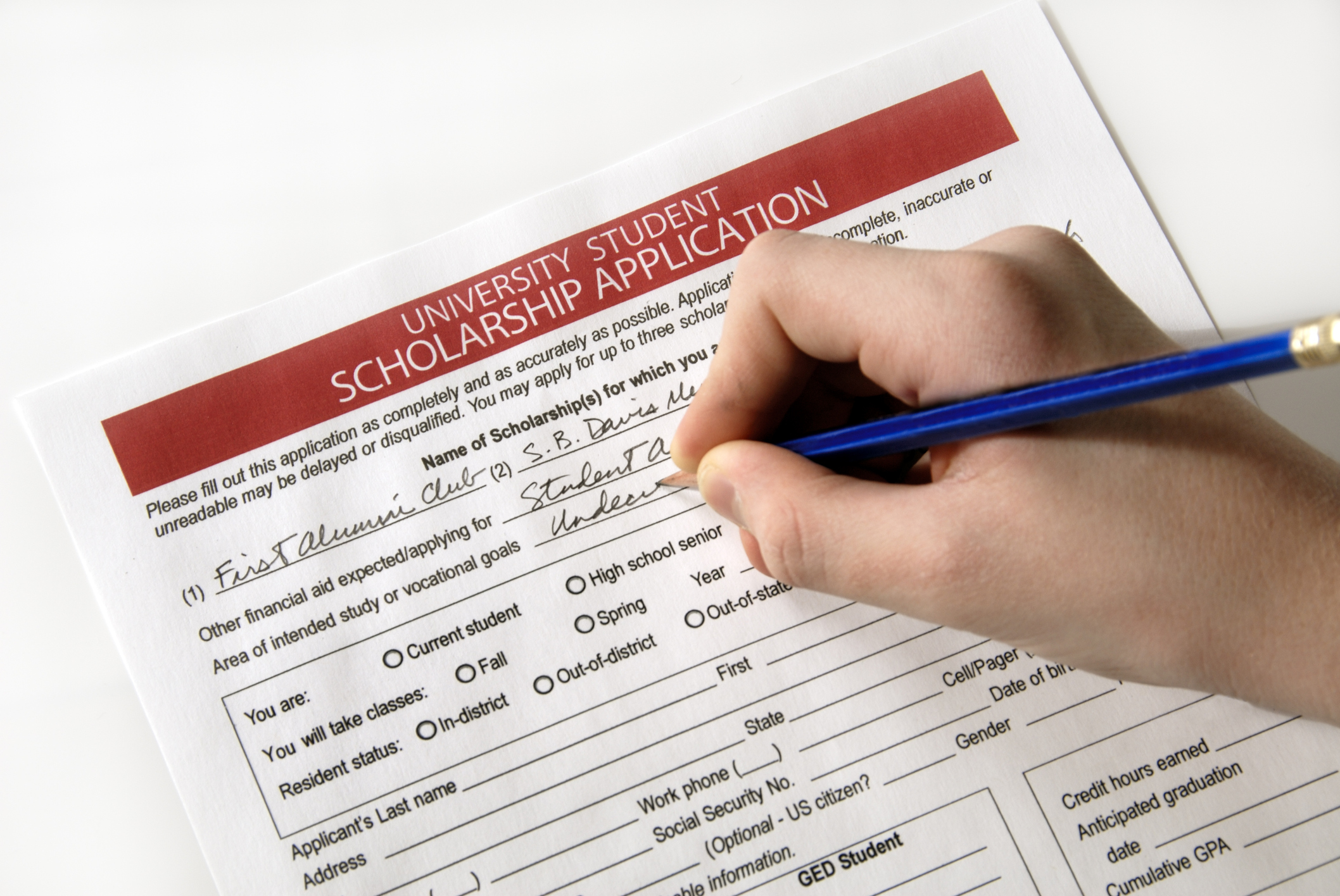 Hand filling out a form