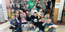 Photo of volunteer and group of students during CALM