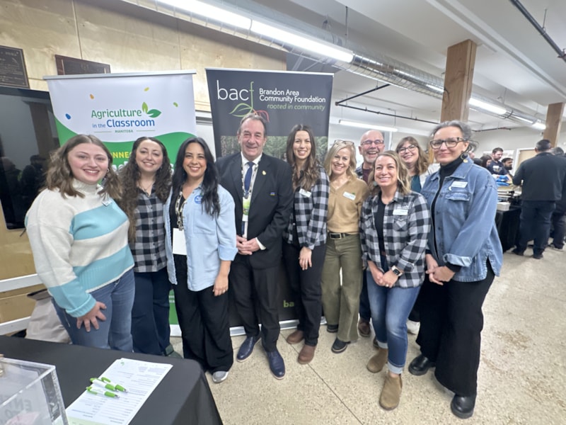 Employees smiling together at event