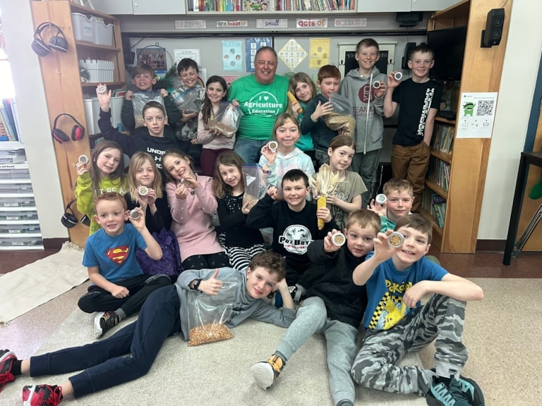 Volunteer with students during Canadian Agricultural Literacy Month