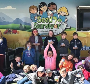 Students in front of Seed Survivor trailer